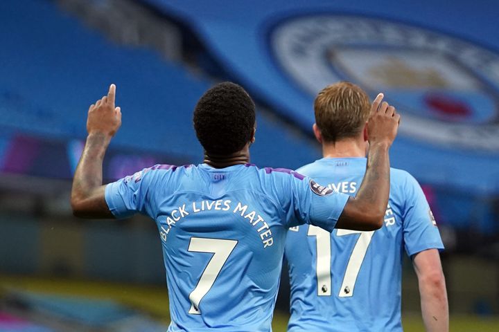 <strong>Manchester City's Raheem Sterling celebrates scoring the opening goal during the Premier League match at the Etihad Stadium, Manchester.</strong>