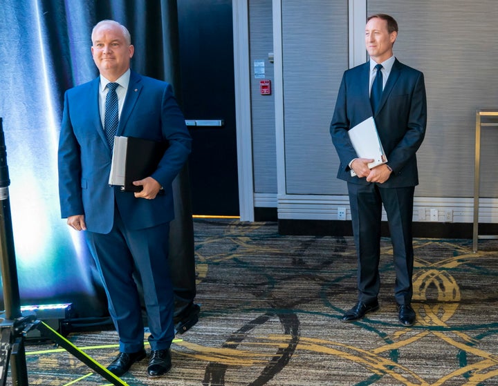 Conservative Party of Canada leadership candidates Erin O'Toole and Peter MacKay wait for the start of the French Leadership Debate in Toronto on June 17, 2020