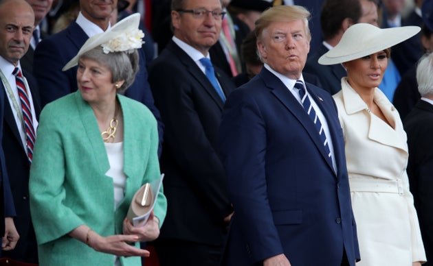 Then-prime minister Theresa May with Donald Trump and Melania Trump during the commemorations for the...