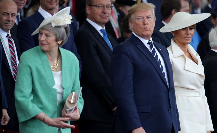 Then-prime minister Theresa May with Donald Trump and Melania Trump during the commemorations for the 75th Anniversary of the D-Day landings at Southsea Common in Portsmouth.