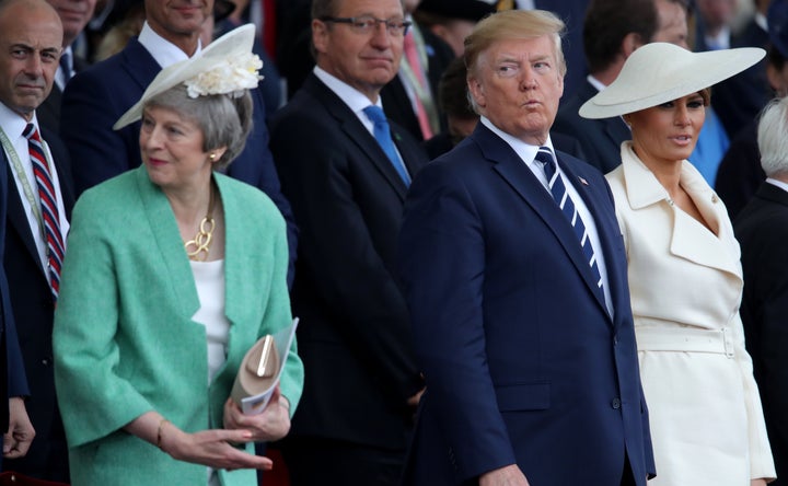 Then-prime minister Theresa May with Donald Trump and Melania Trump during the commemorations for the 75th Anniversary of the D-Day landings at Southsea Common in Portsmouth.