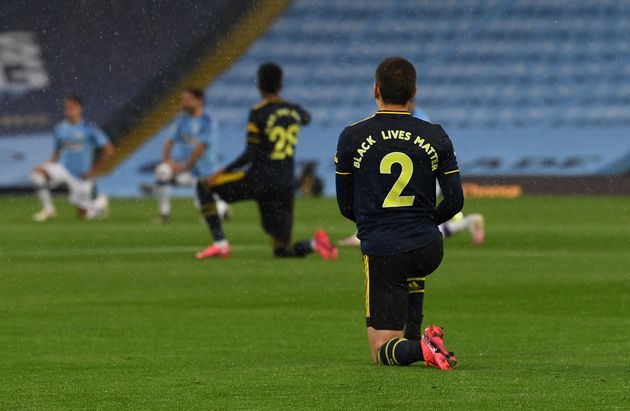 Hector Bellerin of Arsenal takes knee in support of Black Live Matter before the Premier League match between Manchester City and Arsenal FC.