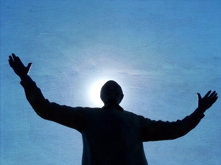 Low Angle View Of Nelson Mandela Statue Against Blue Sky