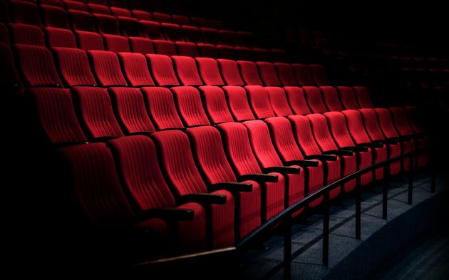 Rows of red seats in a theater