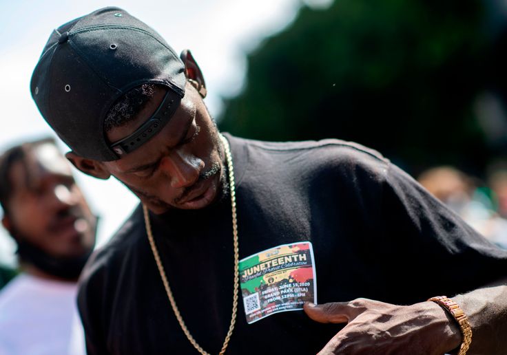 A man wearing a Juneteenth sticker during a demonstration calling for the removal of District Attorney Jackie Lacey in Los Angeles on Wednesday.