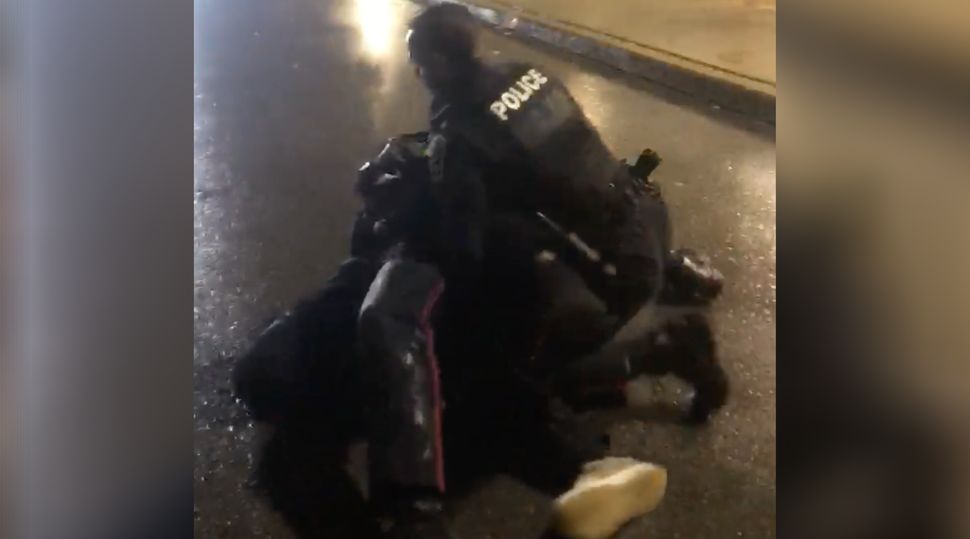 A witness filmed two police officers pinning Livingston Jeffers to the ground outside an Ajax, Ont. hospital, on Oct. 30, 2018.