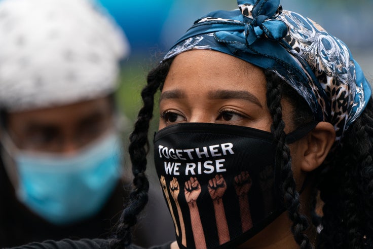 A demonstrator at a Black Lives Matter protest on Wednesday in the Harlem neighborhood of New York City.