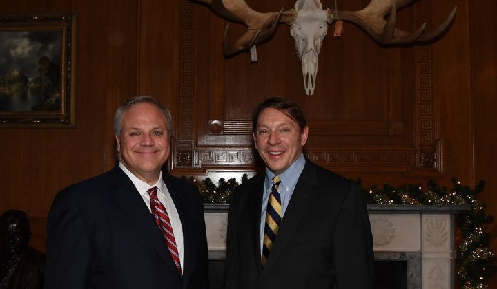 Internal agency documents indicate Steve Milloy (right), who runs a climate change denial blog, enjoyed direct access to high-ranking Interior Department officials as the agency worked on a rule to limit the types of scientific studies used in crafting regulation. The access came after he and Interior Secretary David Bernhardt posed for the above picture at the agency's Christmas party last year.