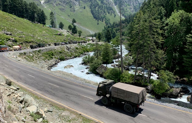 An army convoy moves on the Srinagar- Ladakh highway at Gagangeer, north-east of Srinagar, June 18,