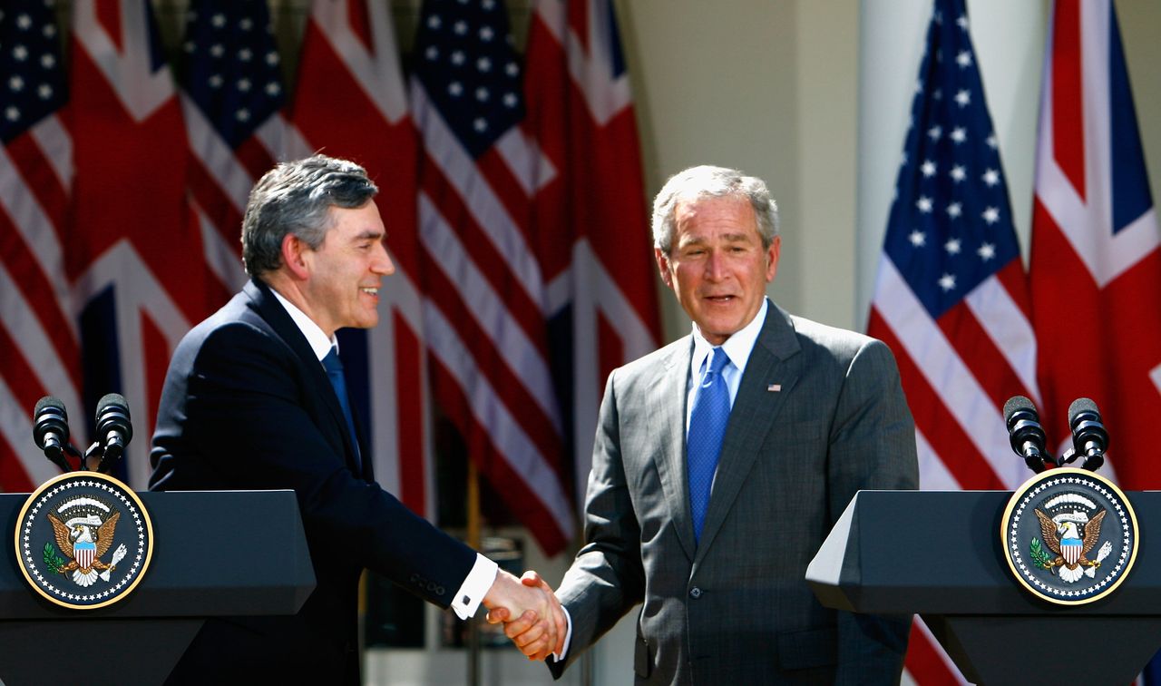 Gordon Brown (L) shakes hands with with US president George W Bush during a joint press conference at the White House, April 17, 2008.