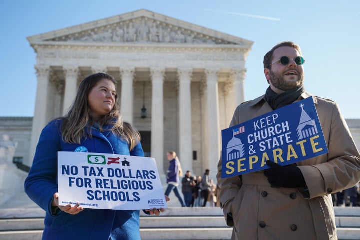 People gather outside the Supreme Court during oral arguments in the Espinoza v. Montana Department of Revenue case on Jan. 22.