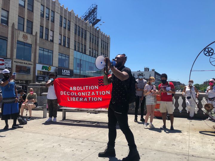 A demonstrator in the Bronx's Fordham neighborhood makes the case against the New York borough's true despoilers during "A People's Tour of the Real Looters of the Bronx" on June 12, 2020.