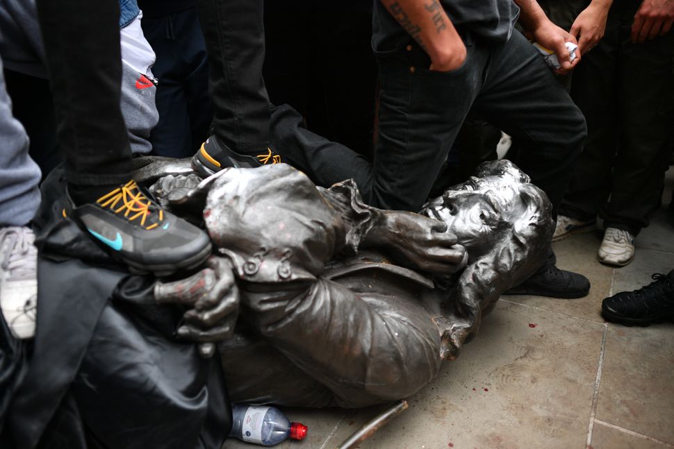 Protesters pull down a statue of Edward Colston during a Black Lives Matter protest rally in College Green, Bristol, in memory of George Floyd, who was killed on May 25 by a white police officer in Minneapolis