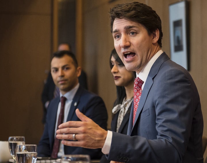 Prime Minister Justin Trudeau, alongside MPs (from left) Marwan Tabbara and Bardish Chagger meet with Region of Waterloo mayors in Kitchener, Ont. on April 17, 2019.