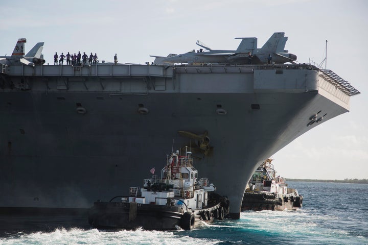 The USS Theodore Roosevelt departs Apra Harbor at Naval Base Guam on Thursday, May 21, 2020, following an extended visit to G