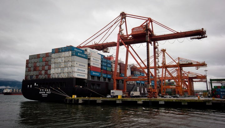 A container ship is unloaded at port in Vancouver on Dec. 23, 2012.