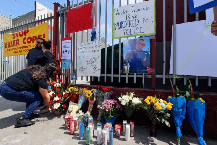 Friends leave candles and flowers at a makeshift memorial for Andres Guardado on Friday in Gardena, California, near where he was fatally shot by a Los Angeles County sheriff's deputy.