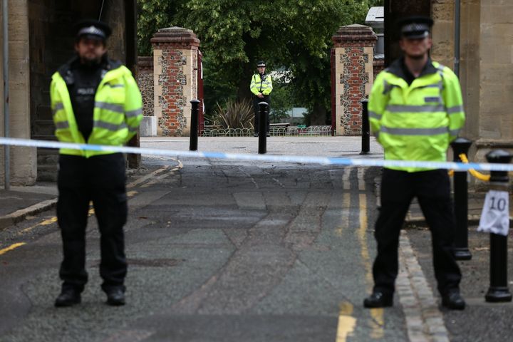 Police at the Abbey gateway of Forbury Gardens in Reading town center following a multiple stabbing attack on Saturday.