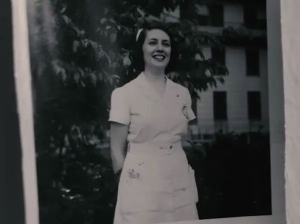 The author in her nurse's uniform at around the age of 21.