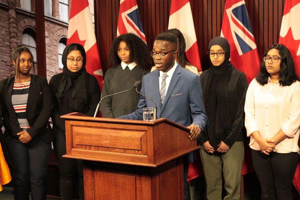 Stephen Mensah, education lead of the Toronto Youth Cabinet, speaks about the cabinet's recommendations to address anti-Black racism in schools at Queen's Park in February 2020. 