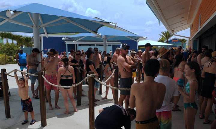 A snack bar line gets crowded at the Island H2O Live water park in Orlando over Memorial Day weekend. The attraction was the only major water park in the area to reopen for the holiday weekend after closing for the coronavirus pandemic.