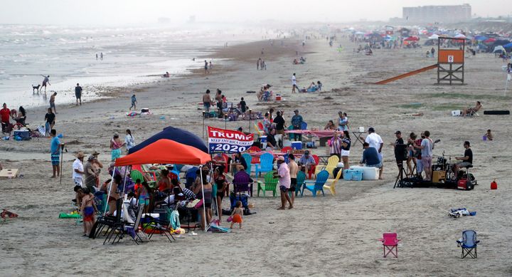 The beach in Port Aransas, Texas, on May 23 shows tight groupings even though beachgoers had been urged to practice social distancing.