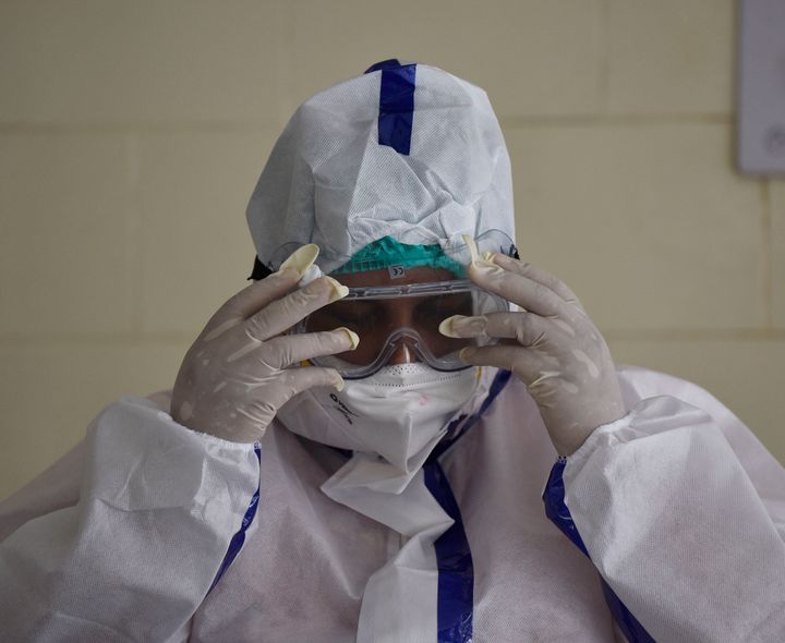 A health worker in PPE coveralls seen during COVID-19 Ag rapid antigen testing, at a dispensary at Mehrauli on June 22, 2020 in New Delhi, India. 