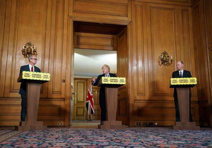 Chief scientific adviser Sir Patrick Vallance, Britain's prime minister Boris Johnson and chief medical officer Professor Chris Whitty take part in a coronavirus media briefing in Downing Street, London, Thursday May 28