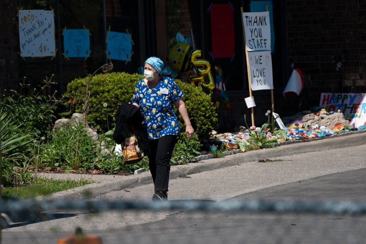 A home-care worker is shown outside Orchard Villa long-term care home in Pickering, Ont., on May 26, 2020.