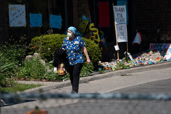 A home-care worker is shown outside Orchard Villa long-term care home in Pickering, Ont., on May 26, 2020. 