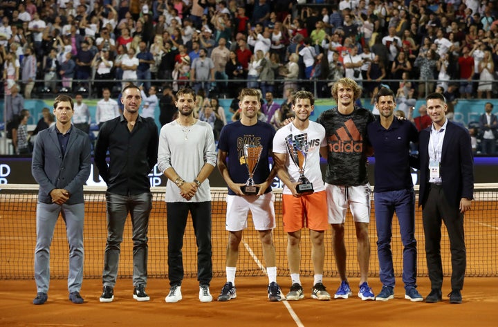 FILE PHOTO: Tennis - Adria Tour - Belgrade, Serbia - June 14, 2020 Austria's Dominic Thiem and runner-up Serbia's Filip Krajinovic pose with their trophies after the final match along with Serbia's Dusan Lajovic, Viktor Troicki, Bulgaria's Grigor Dimitov, Germany's Alexander Zverev, Serbia's Novak Djokovic and Nikola Milojevic REUTERS/Marko Djurica/File Photo