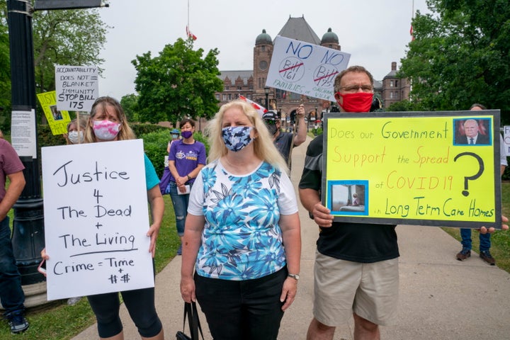 Demonstrators protest against Bill 175 and Bill 161 outside the Ontario legislature in Toronto on June 23, 2020.