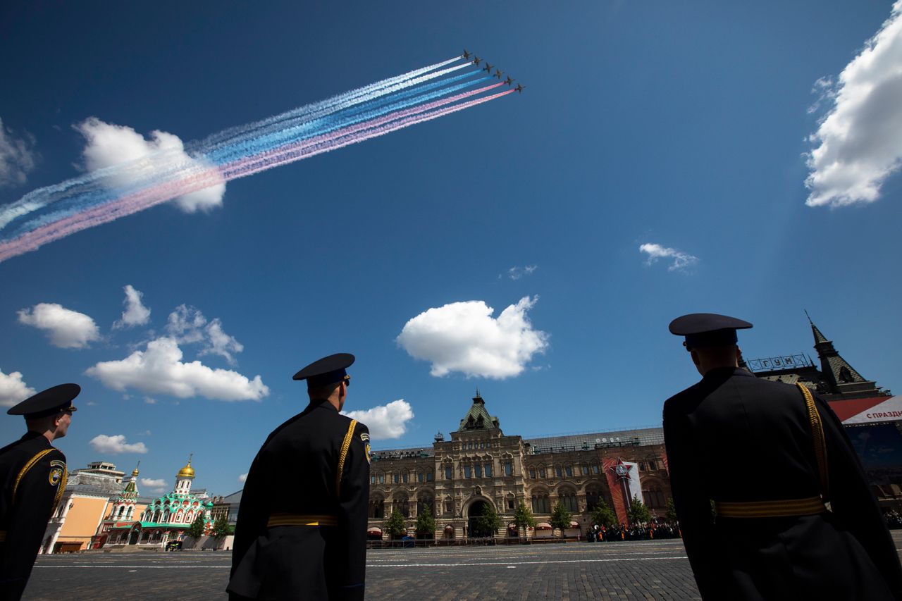 Russian Air Force Su-25 jets fly over Red Square leaving trails of smoke in colors of national flag during the Victory Day military parade marking the 75th anniversary of the Nazi defeat in WWII, in Moscow, Russia, Wednesday, June 24, 2020. The Victory Day parade normally is held on May 9, the nation's most important secular holiday, but this year it was postponed due to the coronavirus pandemic. (AP Photo/Pavel Golovkin, Pool)