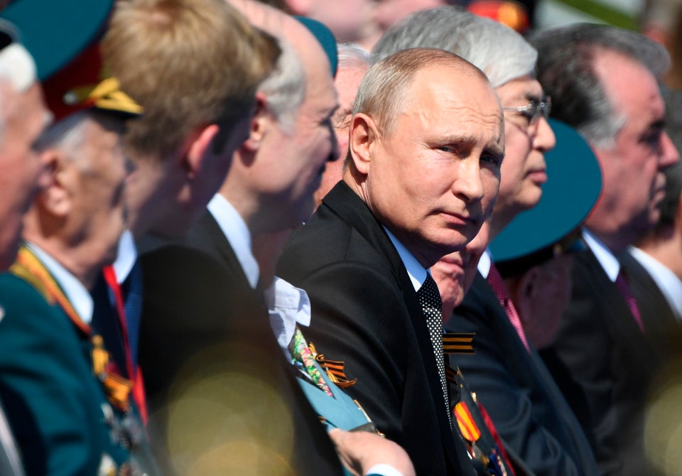 Russian President Vladimir Putin looks on during the Victory Day military parade marking the 75th anniversary of the Nazi defeat on Red Square in Moscow, Russia, Wednesday, June 24, 2020. The Victory Day parade normally is held on May 9, the nation's most important secular holiday, but this year it was postponed due to the coronavirus pandemic. (Sergey Pyatakov, Host Photo Agency via AP)
