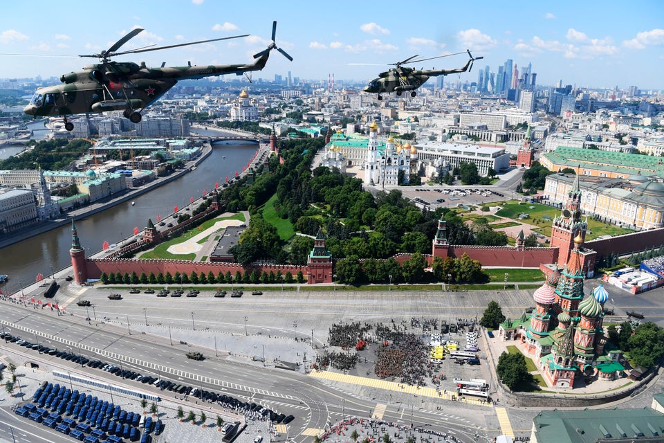 Russian army Mi-8 military helicopters fly over Red Square during the Victory Day military parade marking...