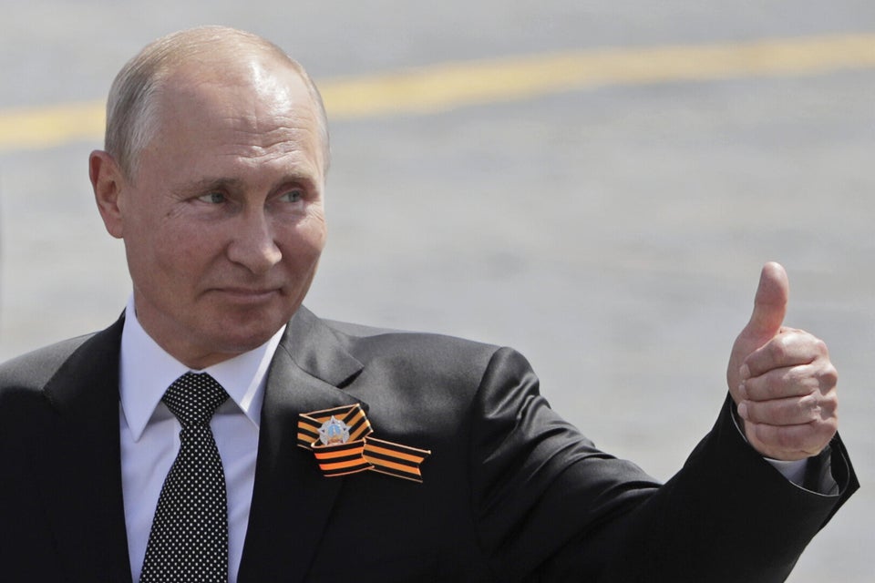 MOSCOW, RUSSIA - JUNE 24, 2020: Russia's President Vladimir Putin thumbs up as he walks in Red Square during a Victory Day military parade marking the 75th anniversary of the victory in World War II. Victory Day parades across Russia have been postponed from 9 May to 24 June due to restrictions imposed to prevent the spread of the novel coronavirus. Mikhail Metzel/TASS (Photo by Mikhail Metzel\TASS via Getty Images)