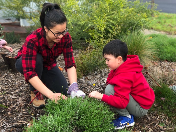 Daughter of Vietnamese refugees, Huong Truong lives in one of Melbourne's COVID-19 'hot spots', local government area Brimbank. Huong pictured here with her son. 