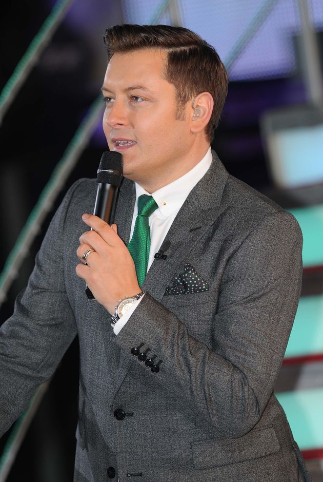 Brian presenting his final series of Celebrity Big Brother in 2013