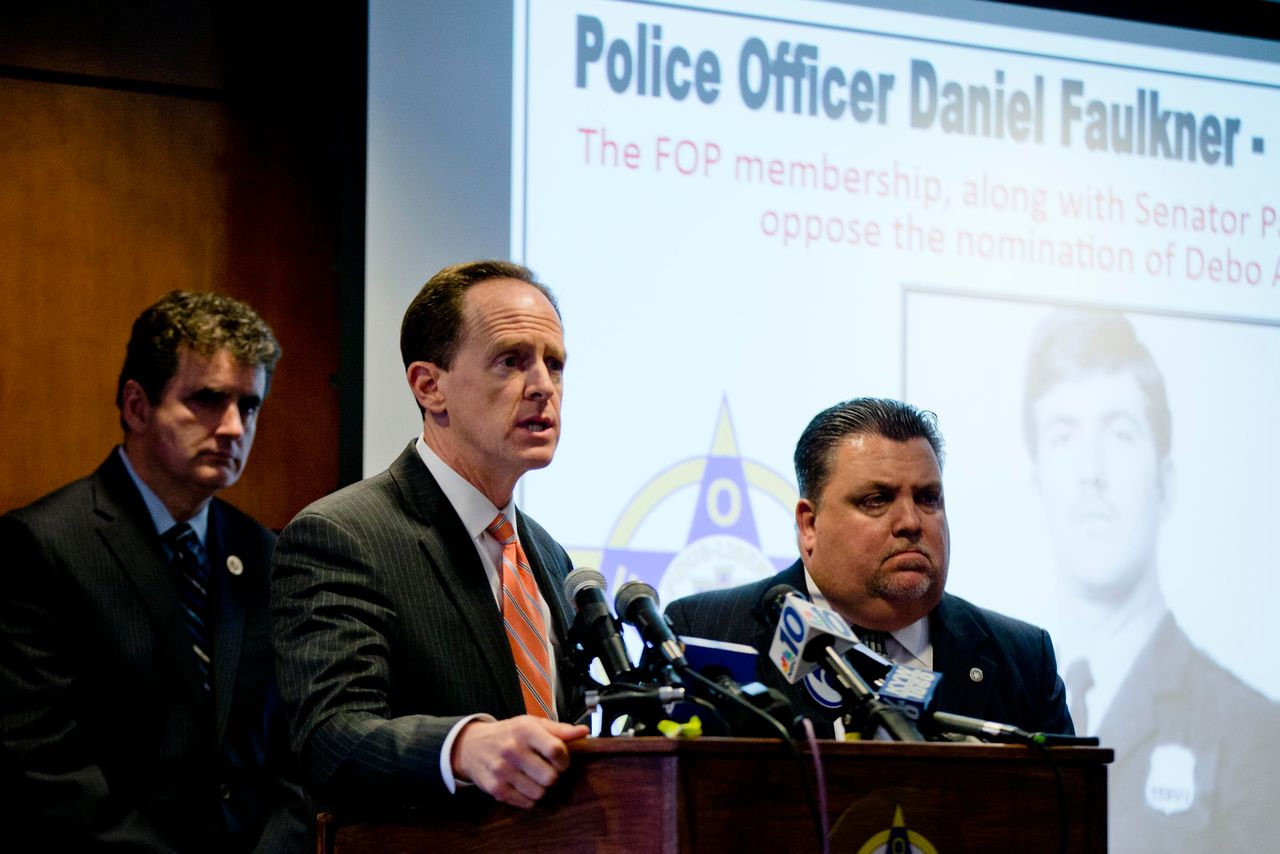 Sen. Pat Toomey (R-Pa.), center, and Rep. Mike Fitzpatrick (R-Pa.), left, were joined by the Fraternal Order of Police's John McNesby during a news conference in Philadelphia, where they discussed their opposition to Adegbile's nomination.