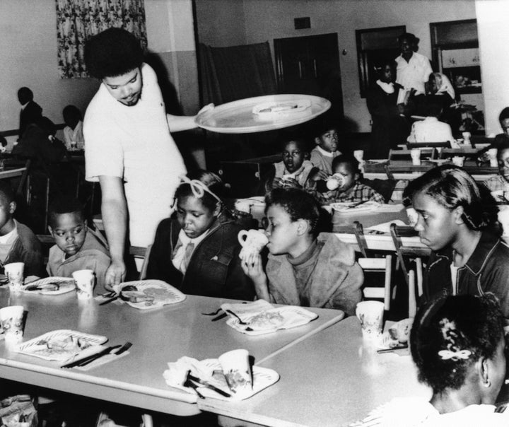 A member of the Black Panther chapter in Kansas City serves free breakfast to children in April 1969 before they go to school. The free breakfast initiative was one of what Black Panther co-founder Huey Newton called the party's "survival programs."