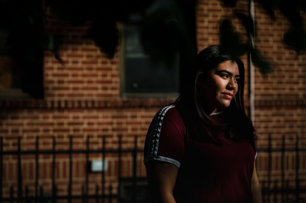 Odalys Garate near her home in the Corona neighborhood of Queens in New York City. The 18-year-old's spring has been marked by stress, illness and death. 