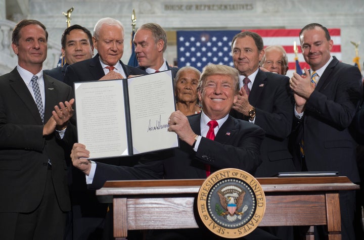 President Donald Trump signs a proclamation shrinking Bears Ears and Grand Staircase-Escalante national monuments at the Utah State Capitol in Salt Lake City, Utah, in December 2017.