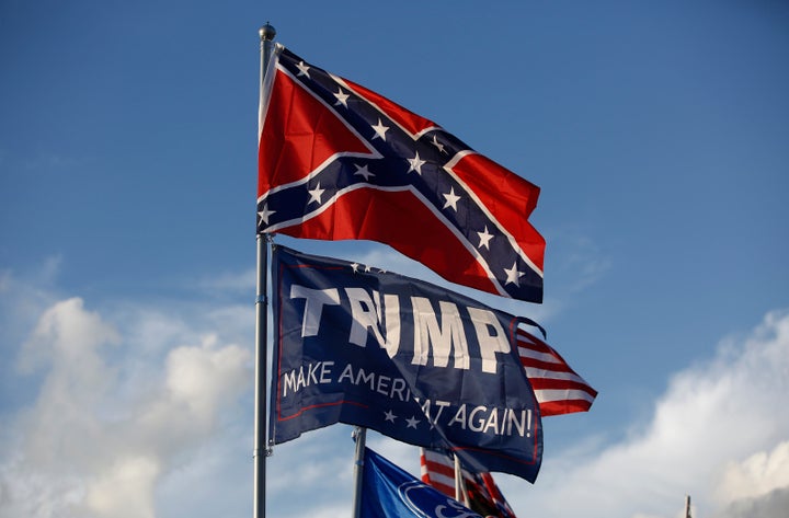 A Trump "Make America Great Again" flag flies below a Confederate flag at a private campground by the Bristol Motor Speedway in Bristol, Tennesee. NASCAR recently banned Confederate flags from its tracks.