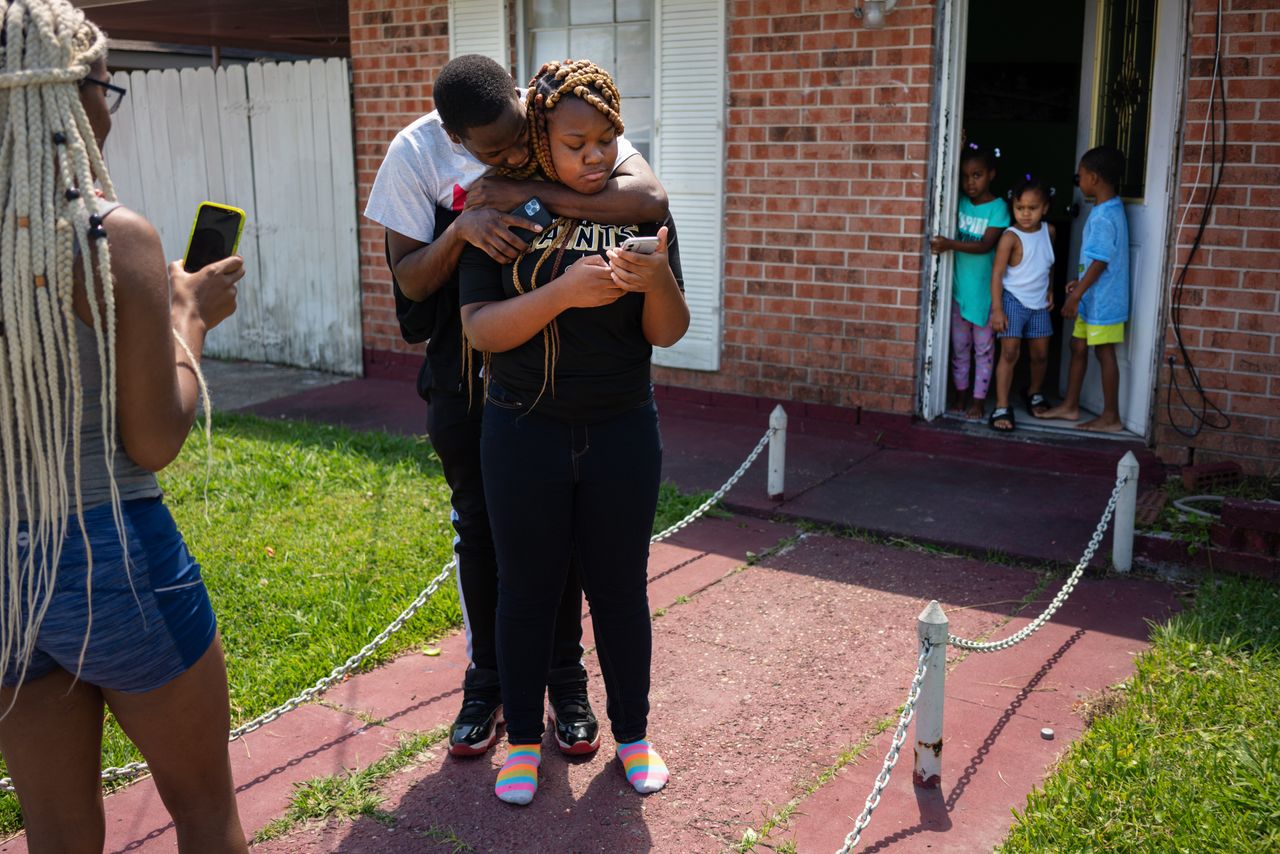 Troynique Turner, left, and Troy Green Jr. try to console their sister, Trevianne, who had just found out over a Zoom call that she was salutatorian — not valedictorian — of her graduating class. Her grades were so strong as she entered her senior year that she had hoped to be the top scholar in her class.