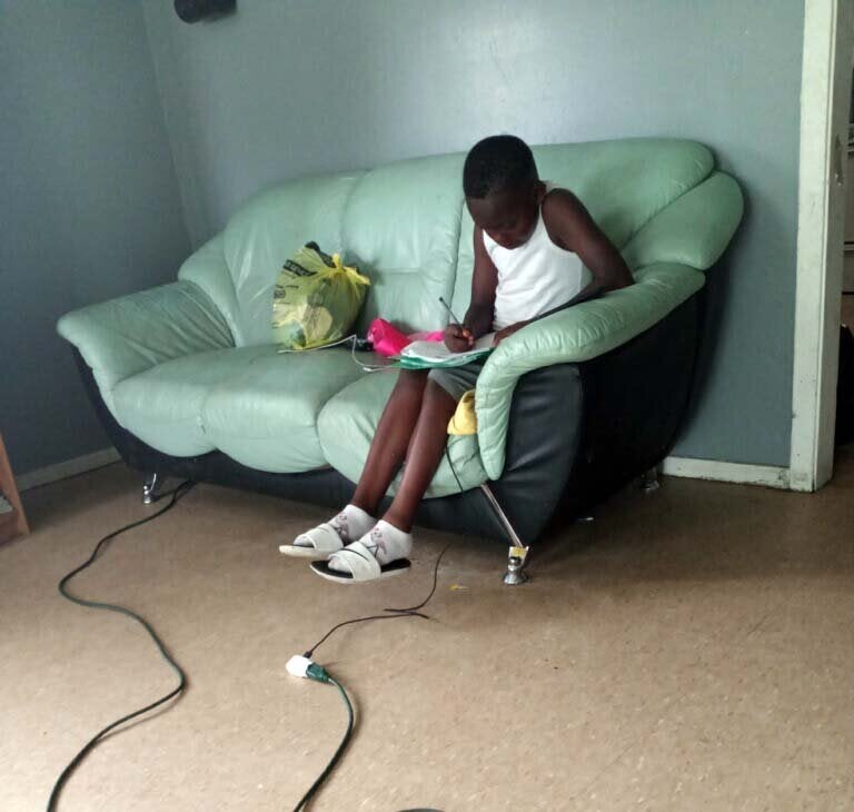 Amareon works to finish his instructional packet a few hours before the district’s deadline. He had attempted to keep up with lessons his teacher posted online, but then his family became disconnected.