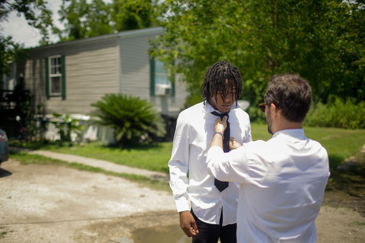 Jarrin Rainey gets help with his tie from mentor and coach Jonny Bartlett, a middle school principal and the varsity baseball coach at Frederick A. Douglass High School. Jarrin began playing on the Douglass baseball team in eighth grade and was immediately one of the team’s best players