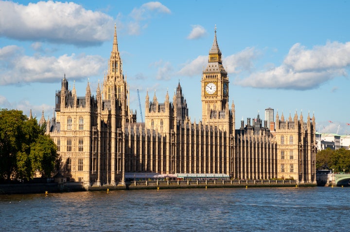 View across river Thames on Houses of Parliament in London, UK