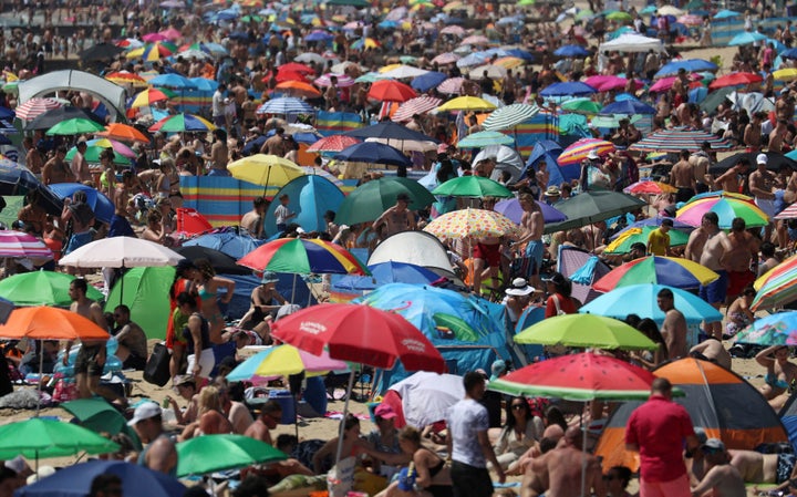 Crowds gather on the beach in Bournemouth.