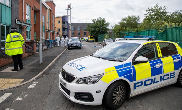 Police at the scene of a fatal shooting in the Manchester