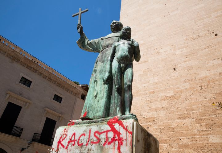 A statue of Catholic St. Junipero Serra in Palma de Mallorca, Spain, on Monday after it was daubed with graffiti reading "racist."